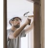 carpenter installing a door jamb at home LFY5VK6