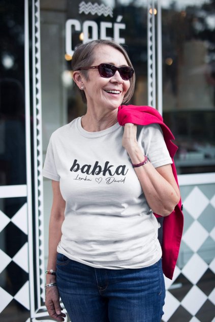smiling stylish senior woman wearing a tshirt mockup on the street a20664